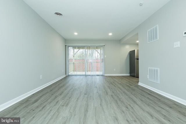 empty room with light wood-type flooring