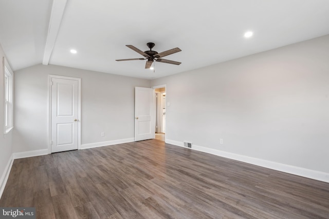 empty room featuring vaulted ceiling with beams, ceiling fan, and dark wood-type flooring