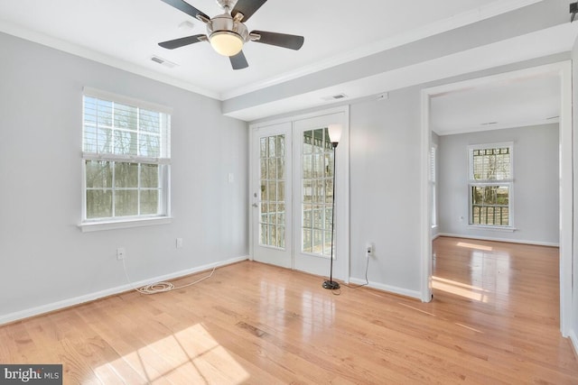 unfurnished room with crown molding, ceiling fan, and light hardwood / wood-style flooring