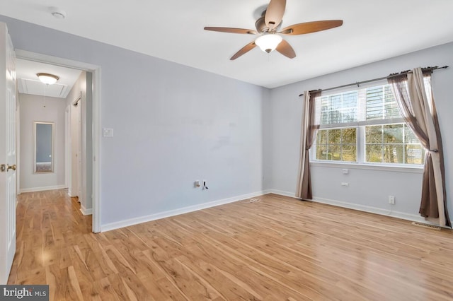 unfurnished room featuring ceiling fan and light hardwood / wood-style flooring