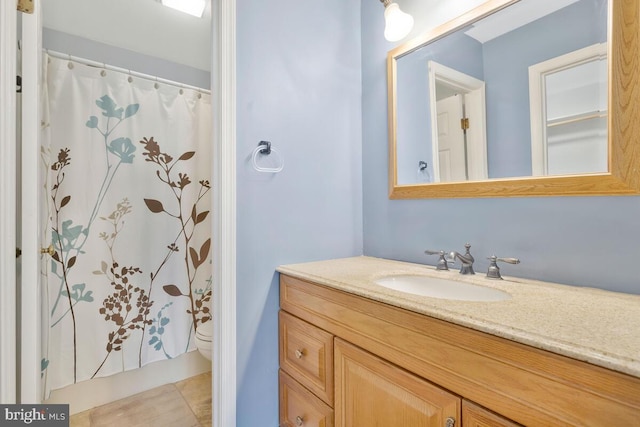 bathroom with vanity, a shower with curtain, and toilet