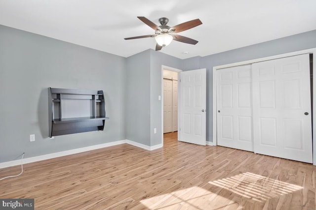 unfurnished bedroom featuring a closet, ceiling fan, and light hardwood / wood-style flooring