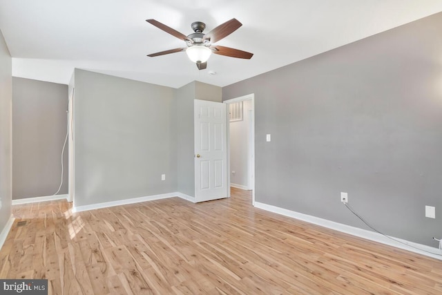 unfurnished room with ceiling fan and light hardwood / wood-style floors