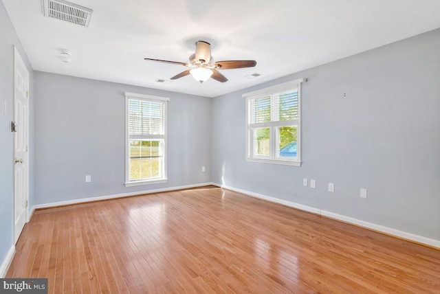 spare room featuring ceiling fan and light wood-type flooring