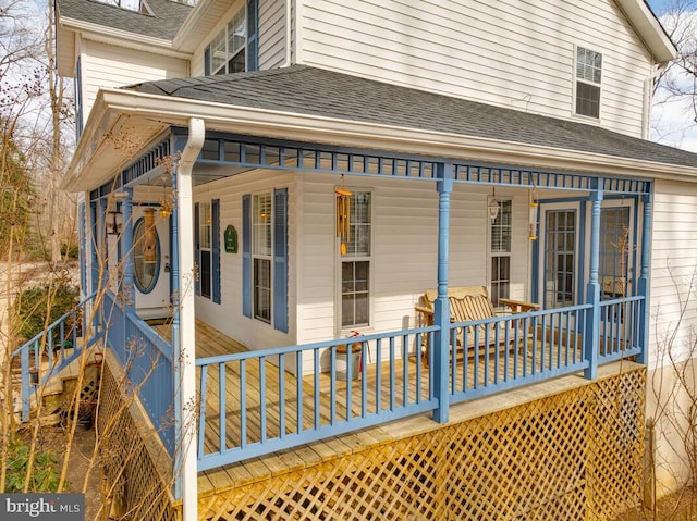 view of property exterior with covered porch