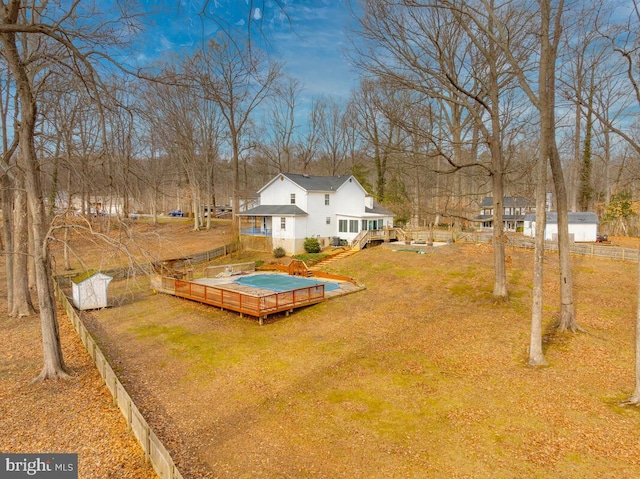 view of yard featuring a swimming pool side deck