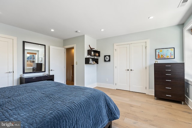 bedroom with light hardwood / wood-style flooring