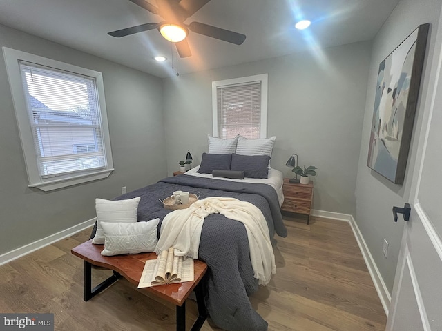 bedroom featuring ceiling fan and light hardwood / wood-style flooring