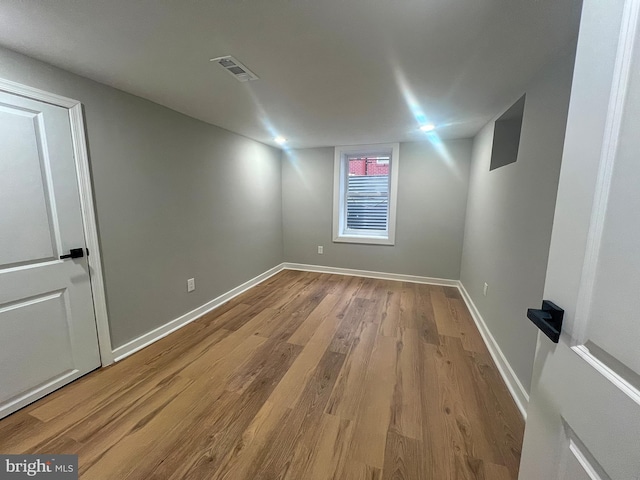 unfurnished room with light hardwood / wood-style floors