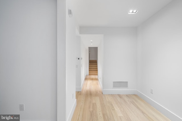 corridor featuring light hardwood / wood-style floors