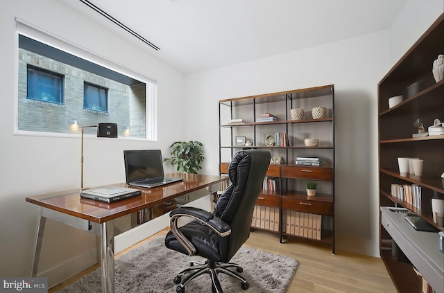 office area with light hardwood / wood-style flooring