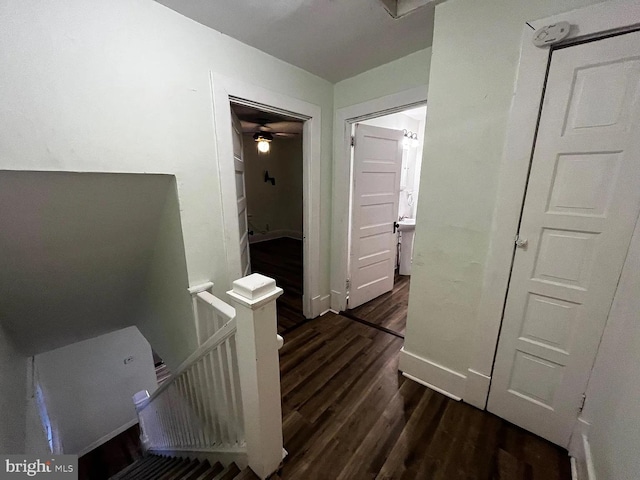 hall with dark hardwood / wood-style flooring