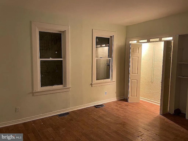 unfurnished bedroom featuring hardwood / wood-style floors