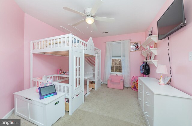 bedroom featuring ceiling fan and light carpet