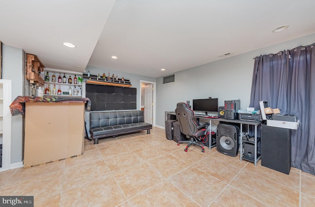 office area featuring bar and tile patterned flooring