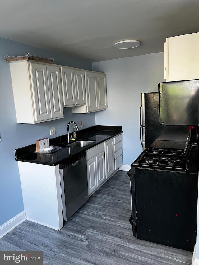 kitchen with black appliances, dark hardwood / wood-style floors, white cabinets, and sink