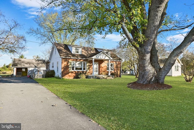 view of front of property with a front yard and a deck