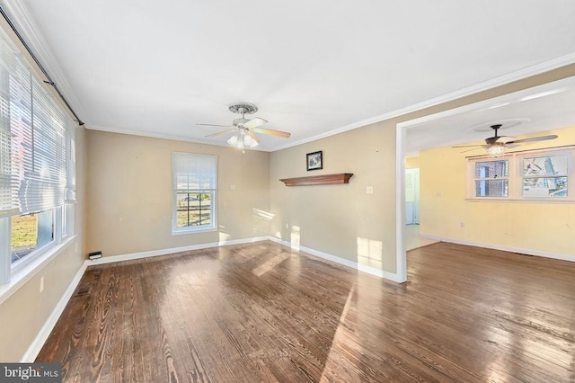 empty room featuring ceiling fan, dark wood-type flooring, and ornamental molding