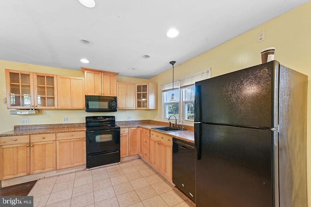 kitchen with sink, light brown cabinets, decorative light fixtures, light tile patterned floors, and black appliances