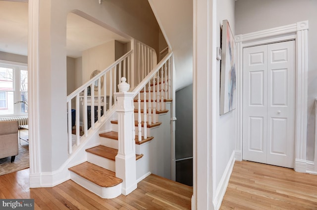 staircase featuring hardwood / wood-style floors