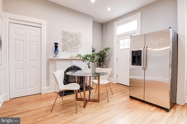 kitchen featuring stainless steel refrigerator with ice dispenser and light wood-type flooring