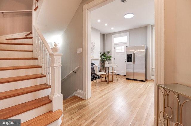 staircase featuring hardwood / wood-style floors