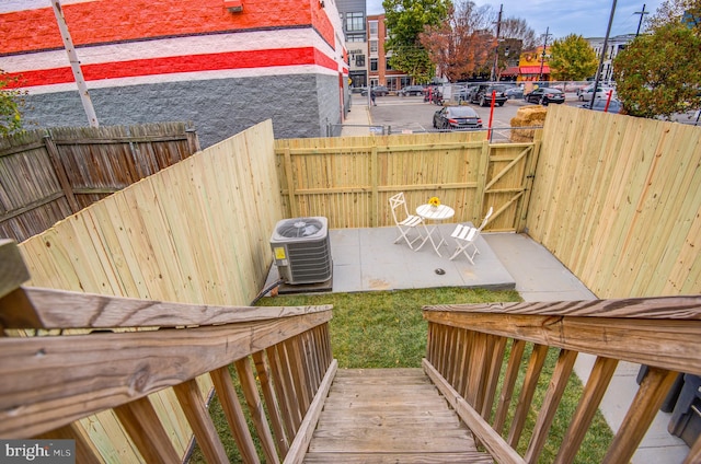 wooden deck featuring central AC