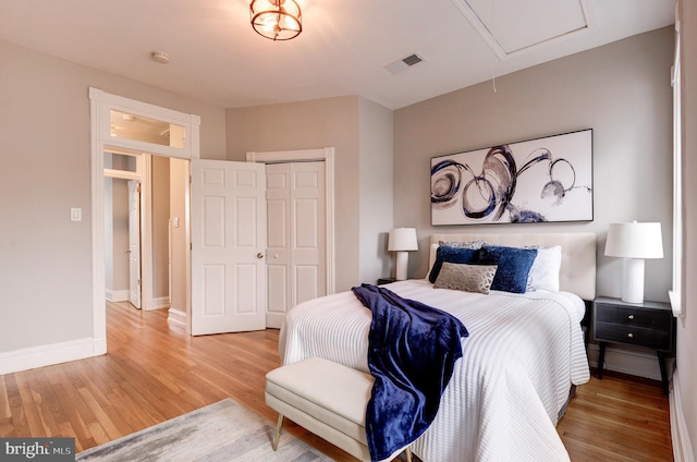 bedroom featuring a closet and hardwood / wood-style floors