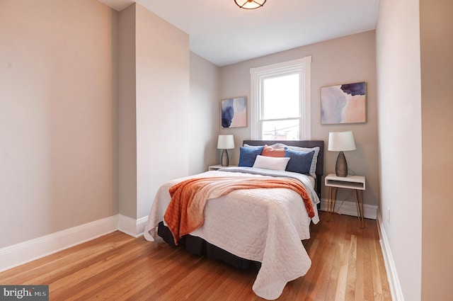 bedroom with light hardwood / wood-style flooring