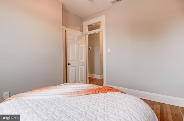 bedroom featuring wood-type flooring