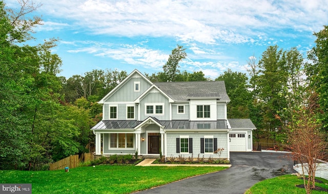 view of front facade with a front yard and a garage