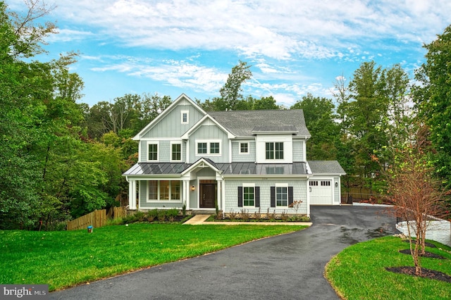 view of front facade featuring a garage and a front lawn