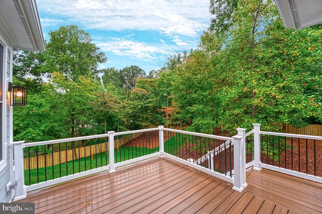 wooden deck with a yard