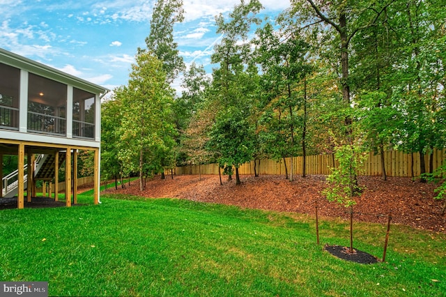 view of yard featuring a sunroom