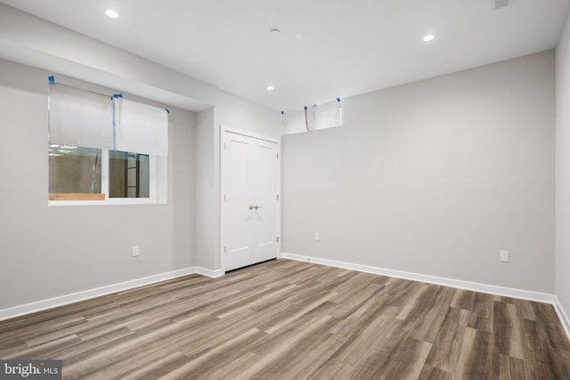 spare room with wood-type flooring