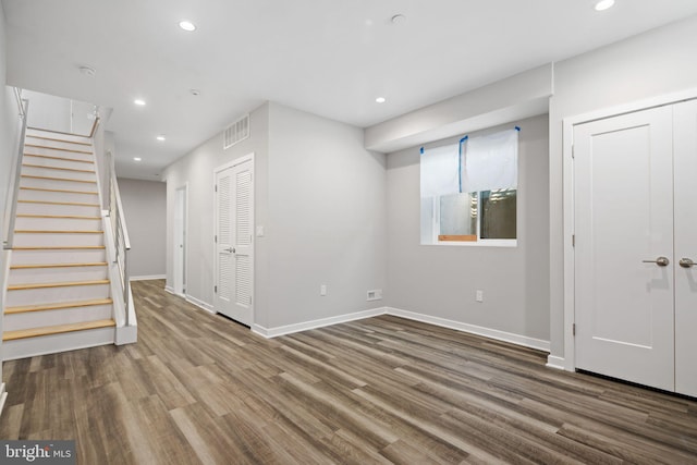 basement with hardwood / wood-style flooring