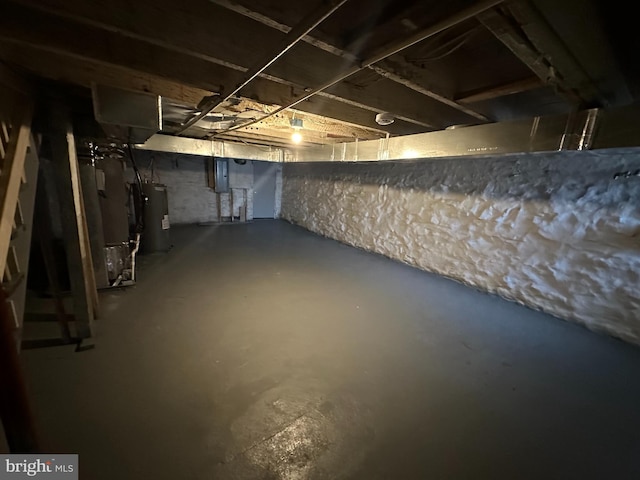 basement with heating unit and electric water heater