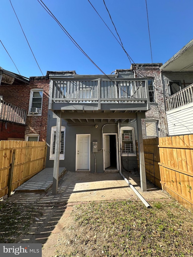 rear view of property with a deck