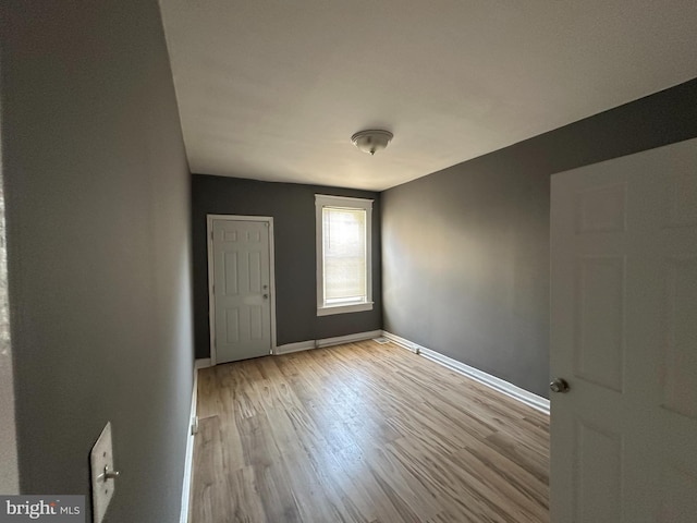 spare room with light hardwood / wood-style flooring