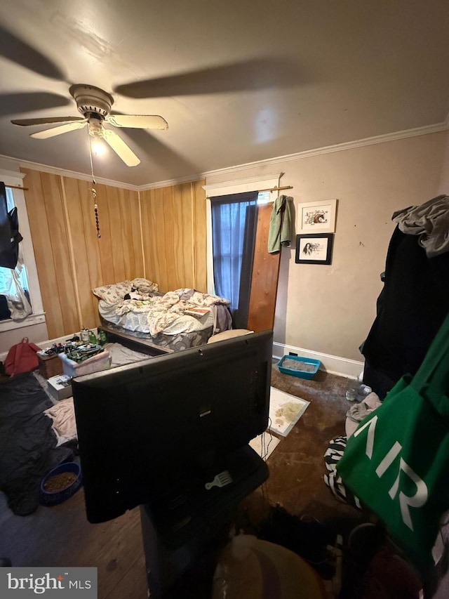 bedroom with ceiling fan, ornamental molding, and dark wood-type flooring