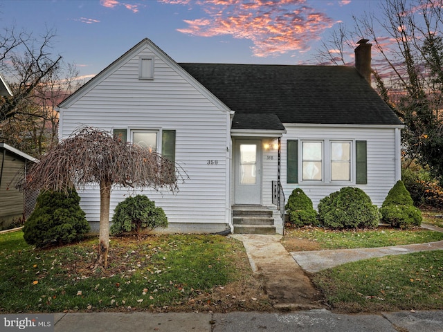 view of front of home featuring a yard