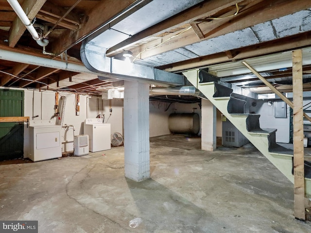 basement with washing machine and clothes dryer