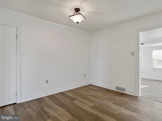 empty room featuring hardwood / wood-style floors