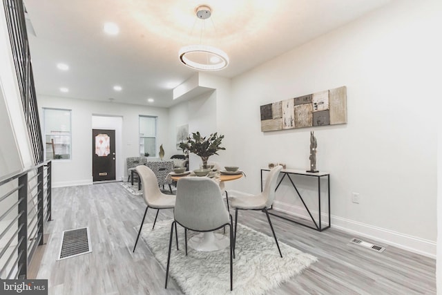 dining space featuring hardwood / wood-style flooring