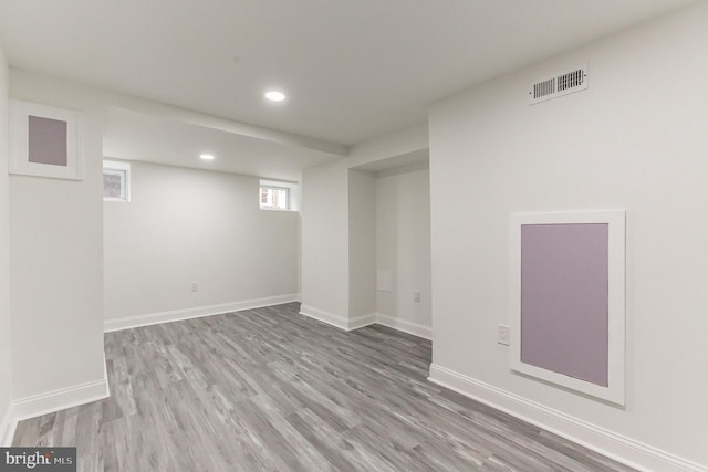 basement featuring light hardwood / wood-style floors