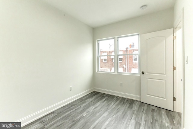 unfurnished room with light hardwood / wood-style floors