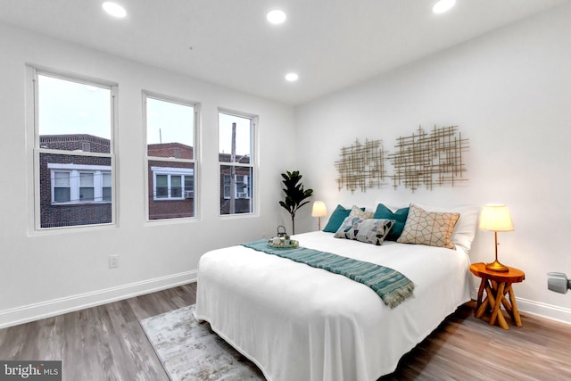 bedroom with wood-type flooring