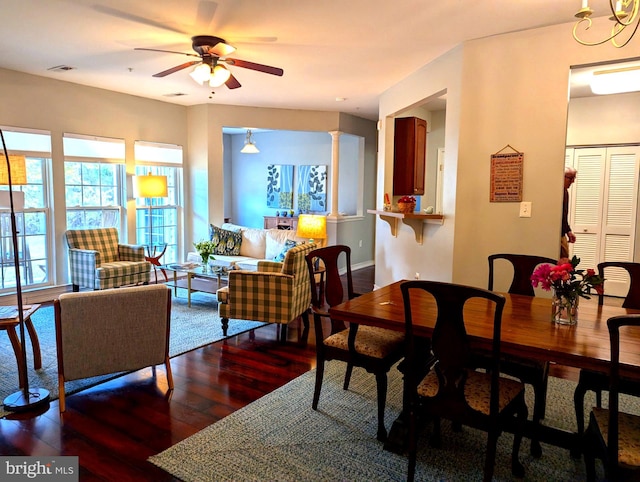 dining space with ceiling fan and dark hardwood / wood-style floors