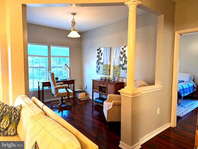 living room with dark wood-type flooring and decorative columns