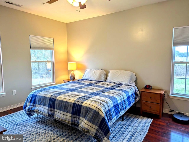 bedroom featuring dark hardwood / wood-style flooring and ceiling fan